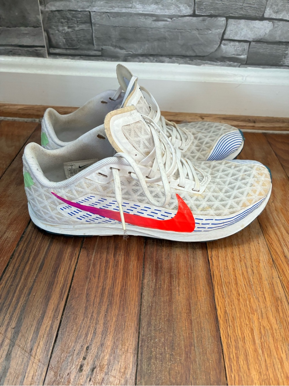 Nike Women's White Running Shoes with Bright Red Swoosh and Blue Accents